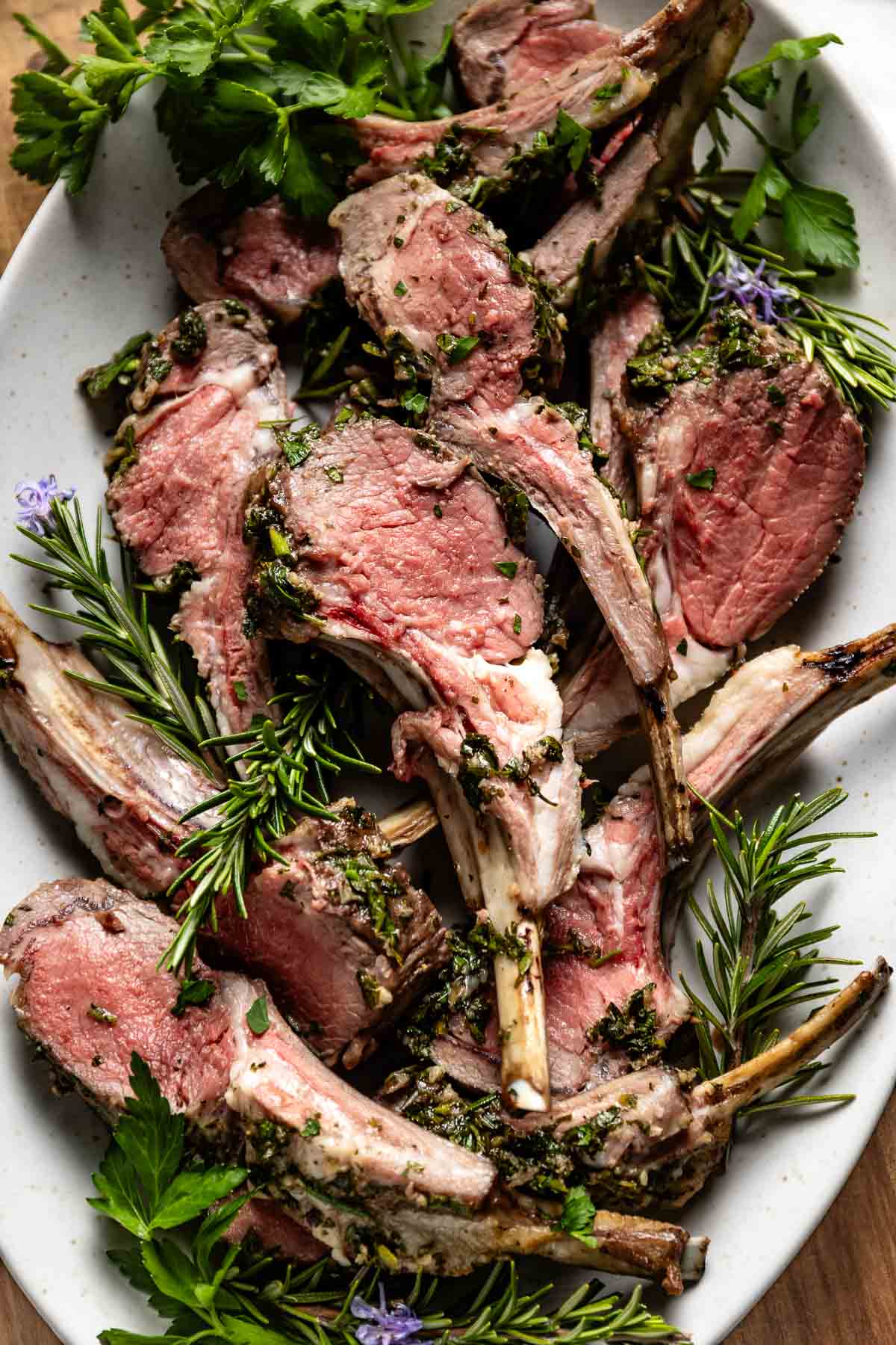 Roasted rack of lamb garnished with rosemary.