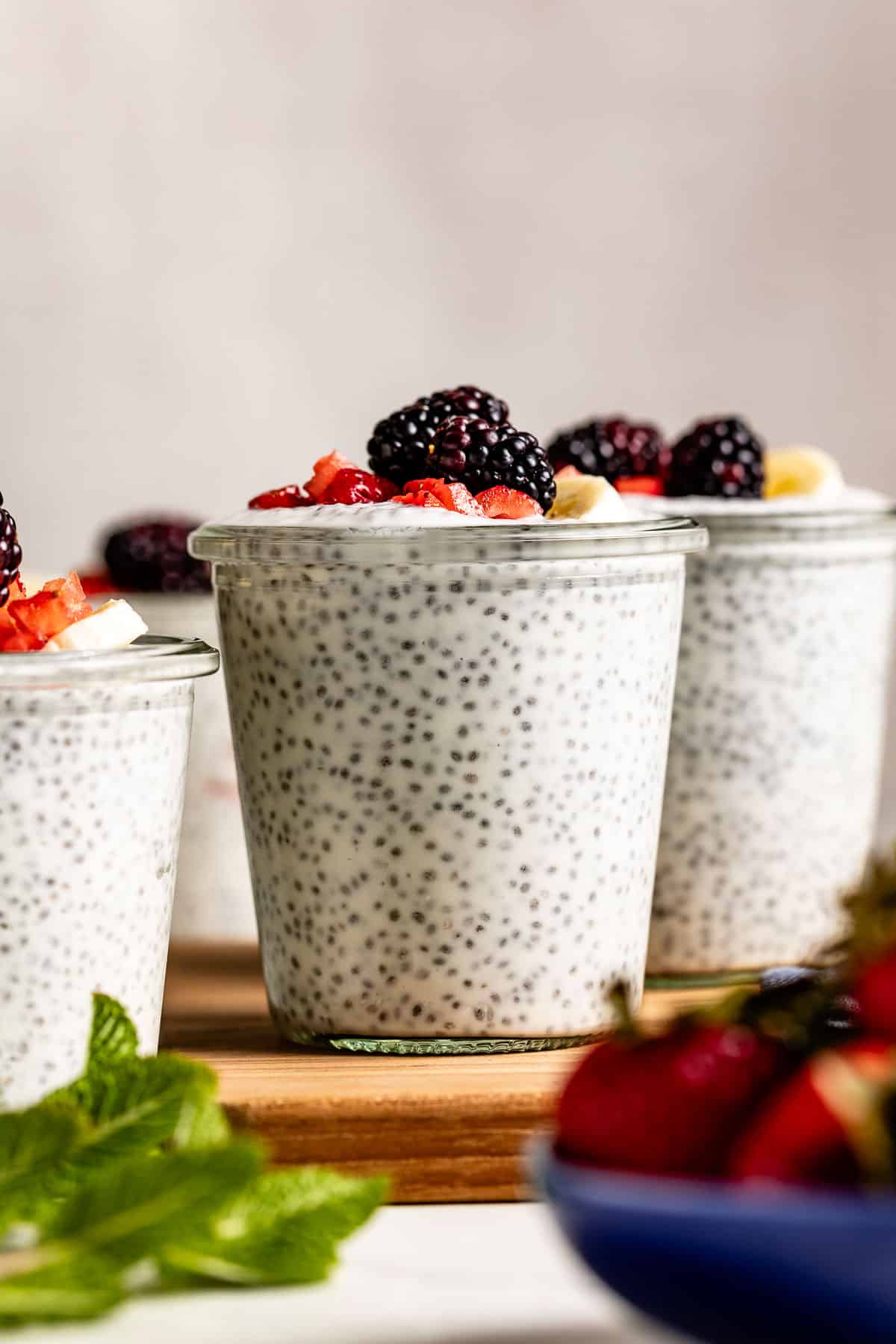 Low calorie high protein chia pudding in a jar topped off with fruit.