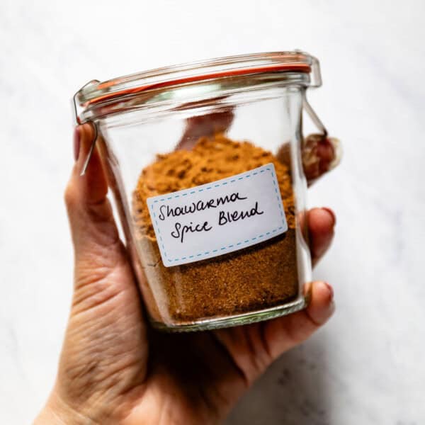 A batch of our Shawarma spice blend recipe in a jar with a label on it.