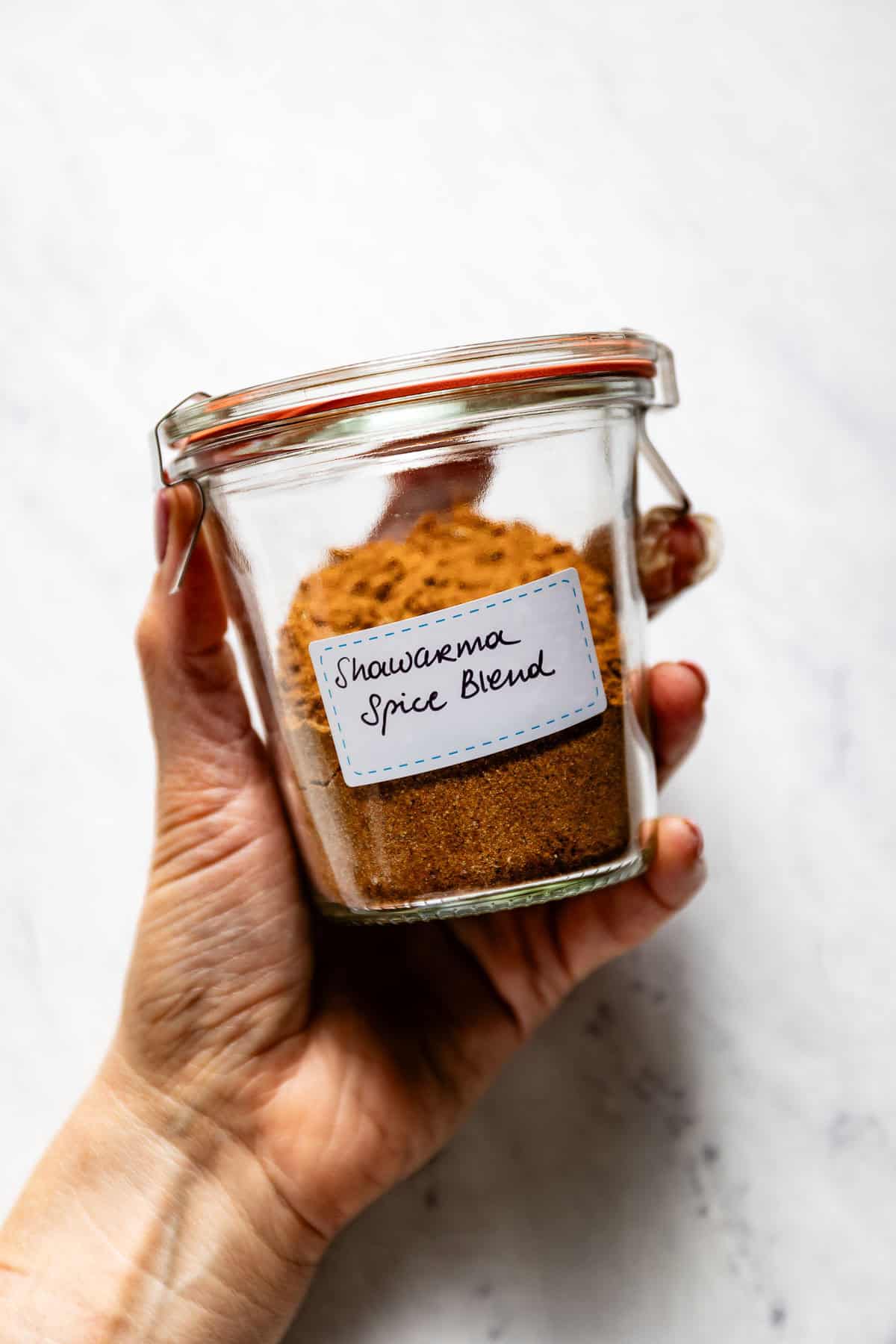 A batch of our Shawarma spice blend recipe in a jar with a label on it.