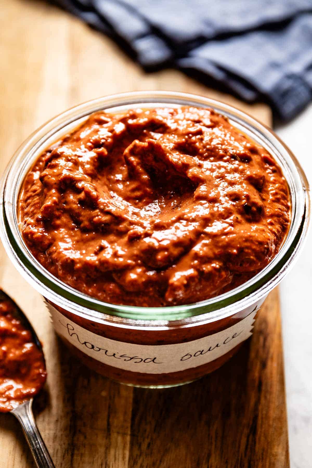 Harissa paste in a jar from the front view.