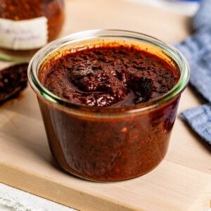 Harissa paste from powder in a jar from the front view.