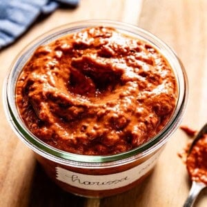 Harissa sauce in a jar from the front view.