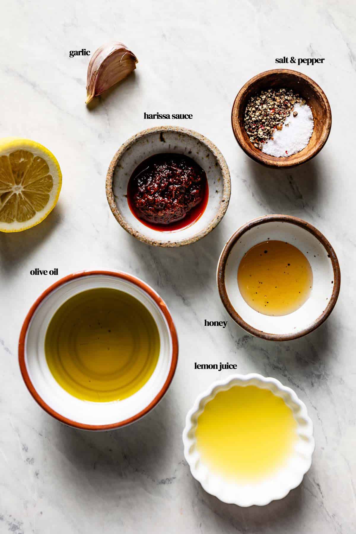 Ingredients for the recipe in small bowls from the top view.