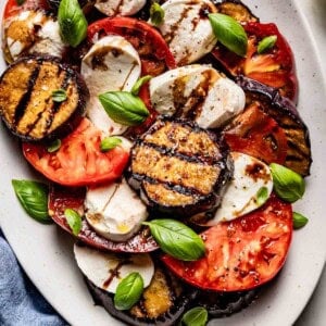 Eggplant caprese on a plate from the top view.