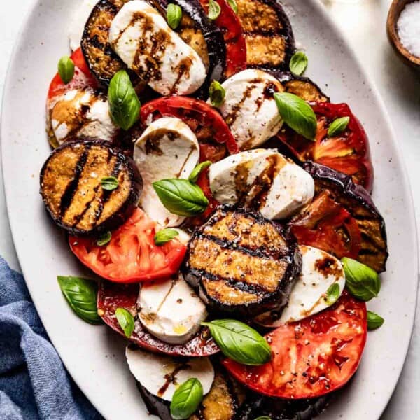 Eggplant caprese salad on a plate from the top view.