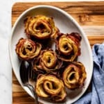 Potato flowers on a plate from the top view with text on the image.