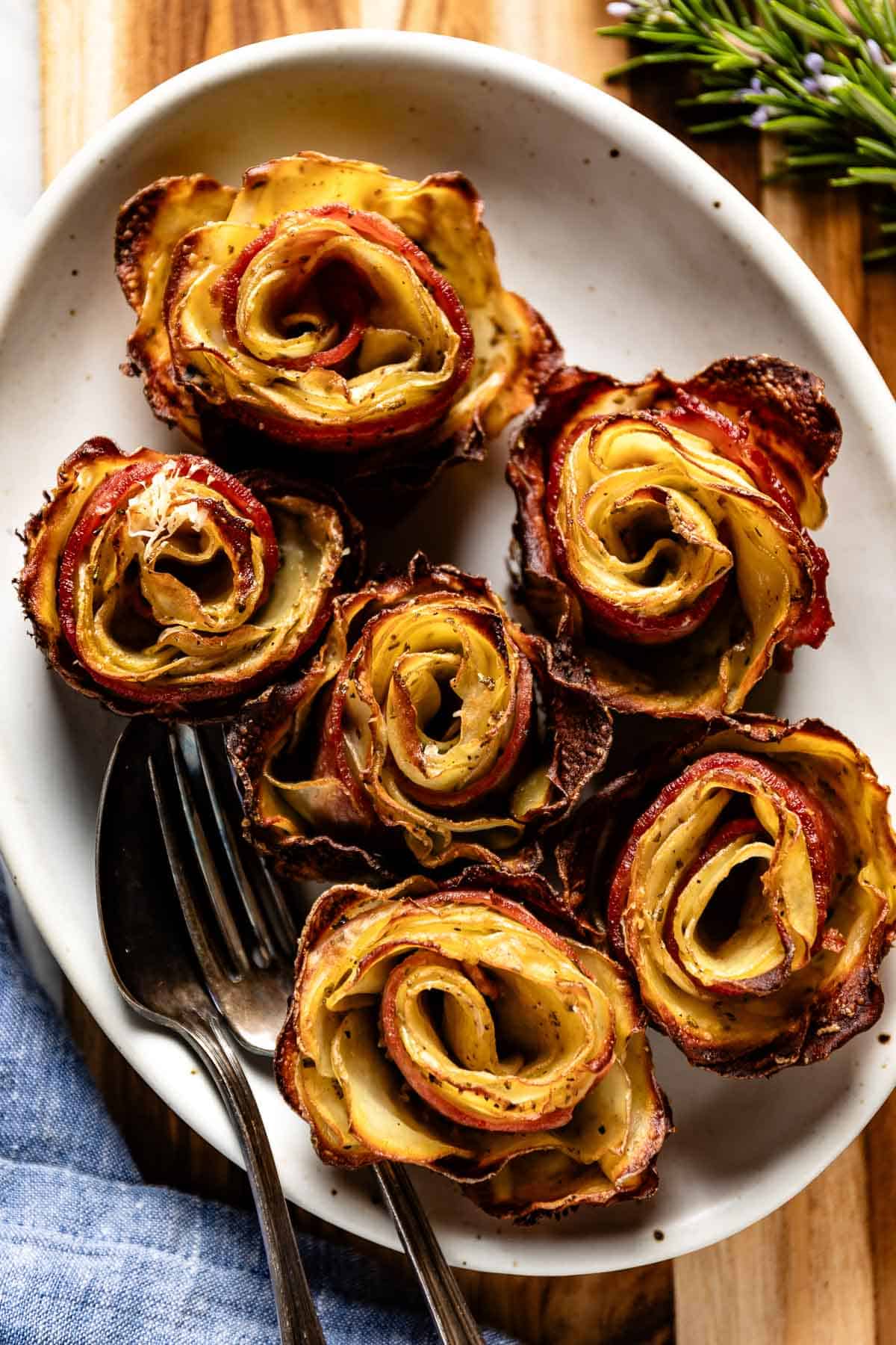 Potato roses on a plate from the top view.