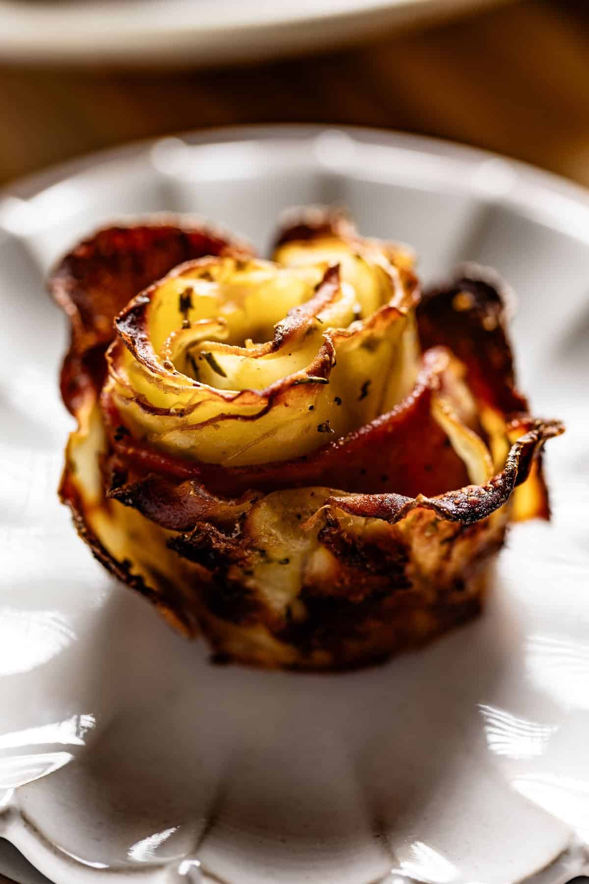 A potato rosette on a plate.