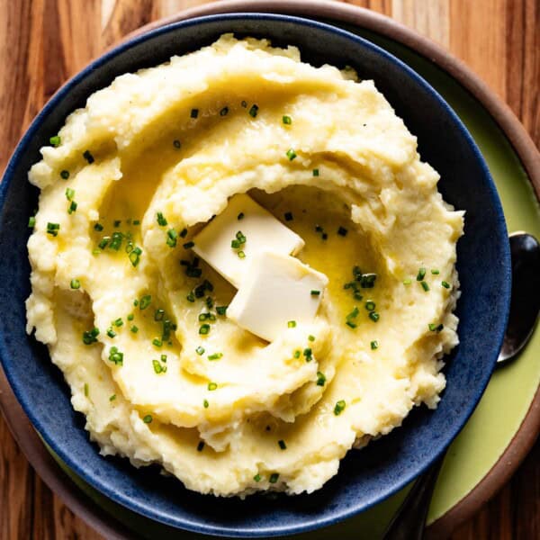 Mashed gold potatoes in a bowl from the top view.