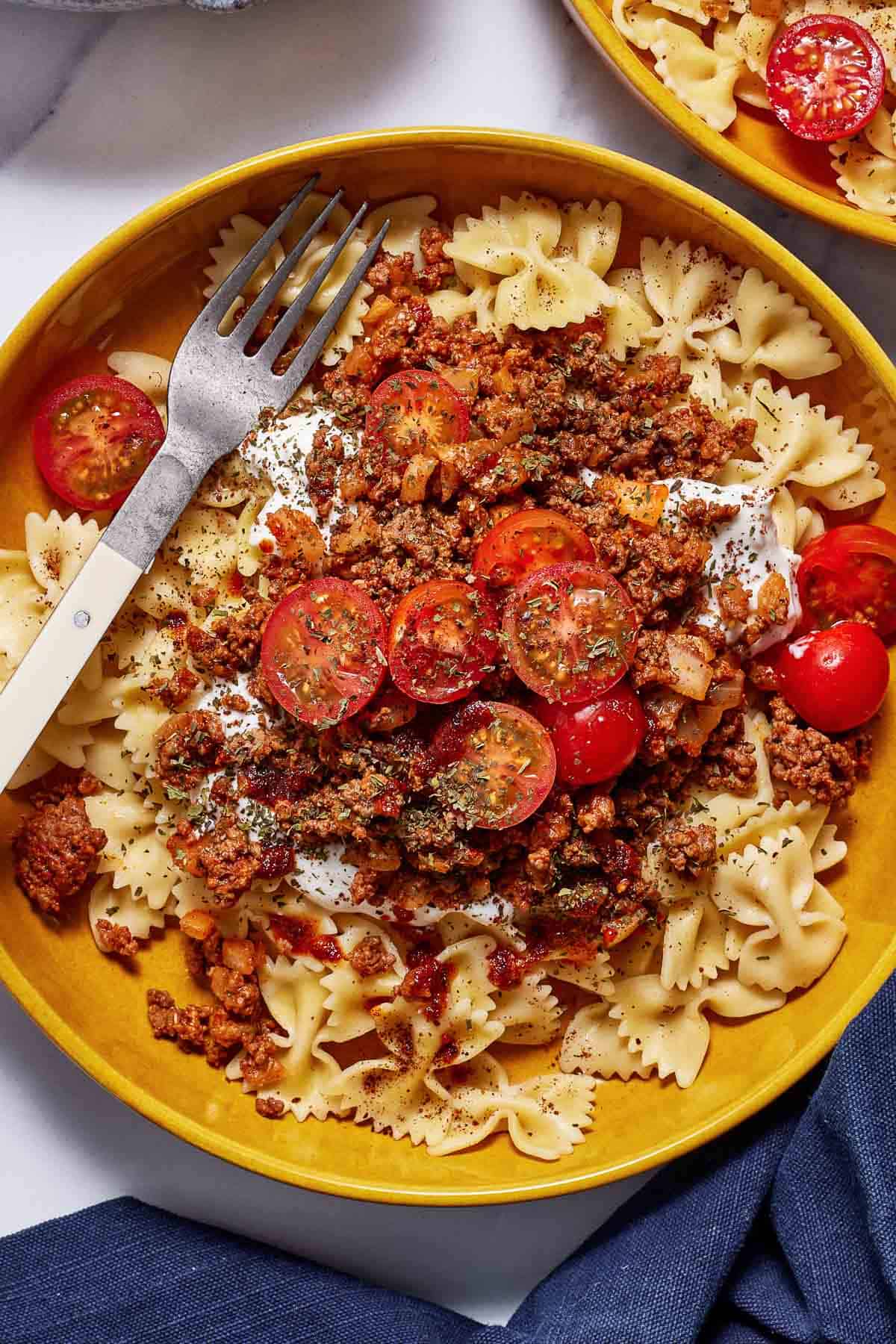 Cheat manti pasta recipe in a bowl with a fork on the side.