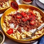 Turkish pasta recipe being drizzled with the melted butter sauce.