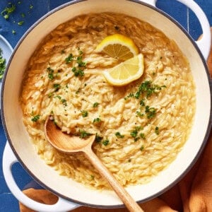 Lemony orzo recipe in a pot garnished with parsley.