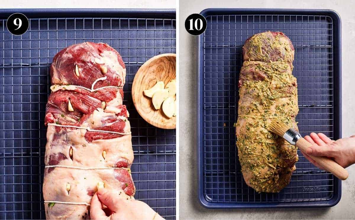 Person inserting sliced garlic in the lamb and seasoning the outside.