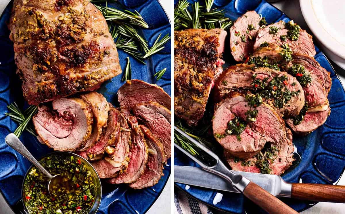 Roasted boneless leg of lamb sliced and served on a blue platter with mint chimichurri sauce and fresh rosemary, showing a pink medium-rare center.