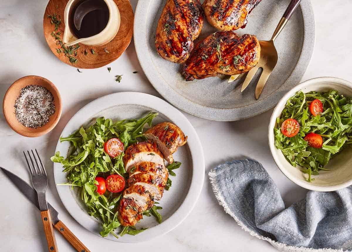Balsamic marinated chicken served with a salad on the side.