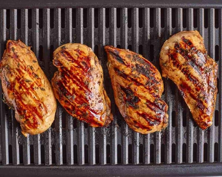 Balsamic grilled chicken on the grill from the top view.