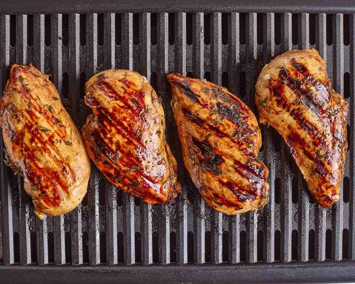 Balsamic marinated chicken breasts on the grill.