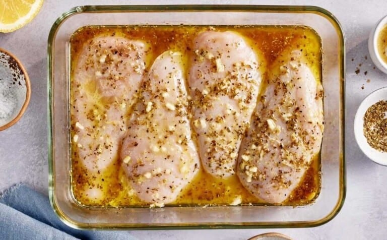 Chicken breasts in the marinade.