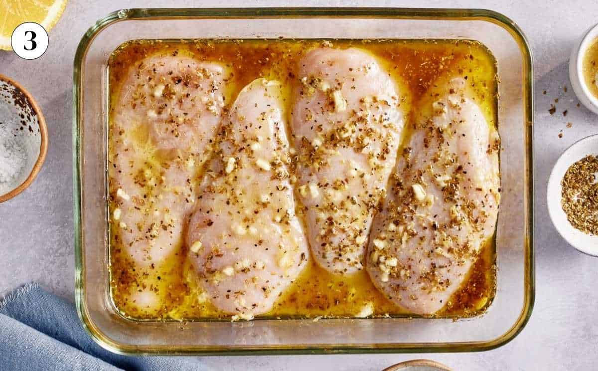 Chicken breasts submerged in the marinade.