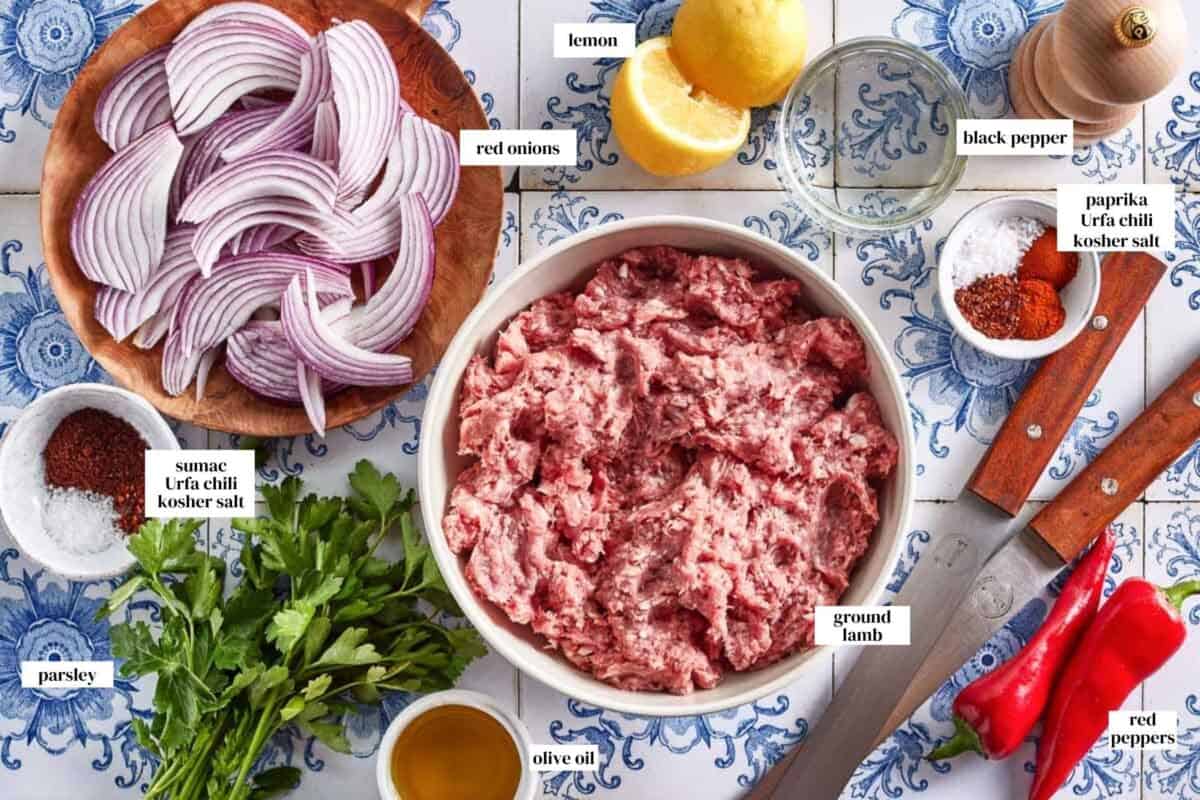 Ingredients for Turkish lamb kebabs in bowls from the top view.