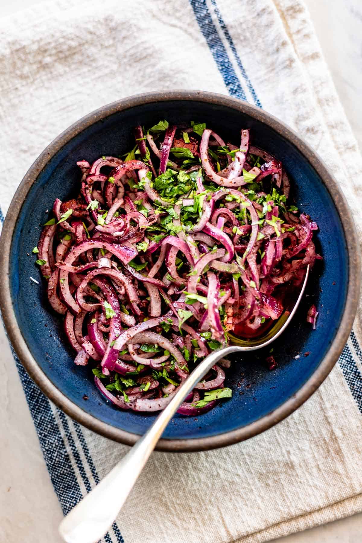 Sumac onions in a bowl from a top view.