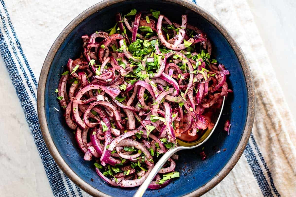 Sumac onions in a bowl from a top view.