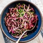 Turkish red onion sumac salad in a bowl from the top view.