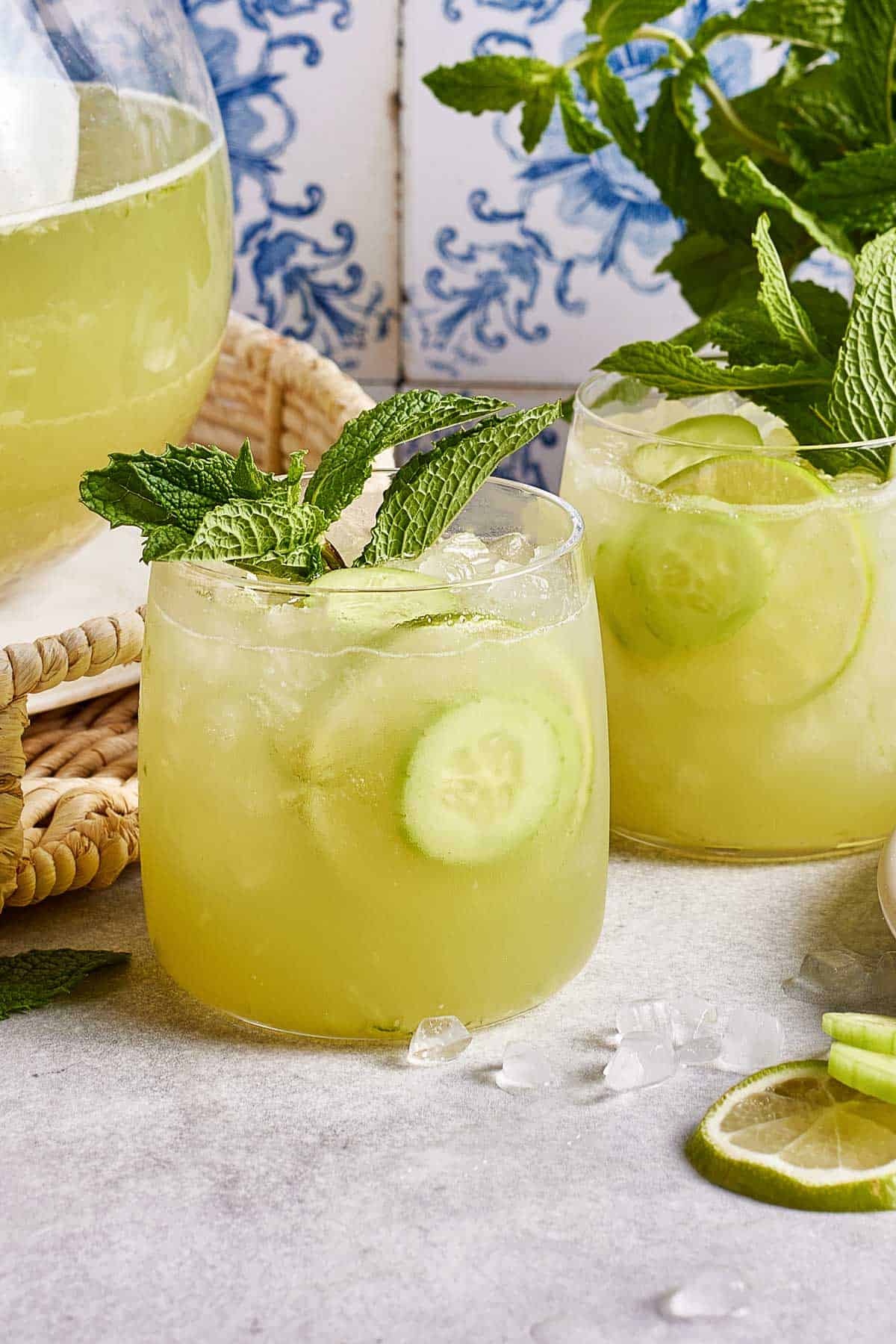 CAVA's Cucumber mint lime drink in a glass garnished with a sprig of mint.