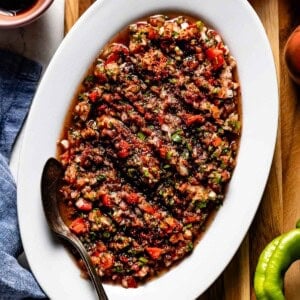 Spicy ezme served on an oval plate from the top view.