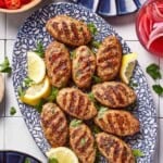 Grilled chicken kofta in a platter from the top view.