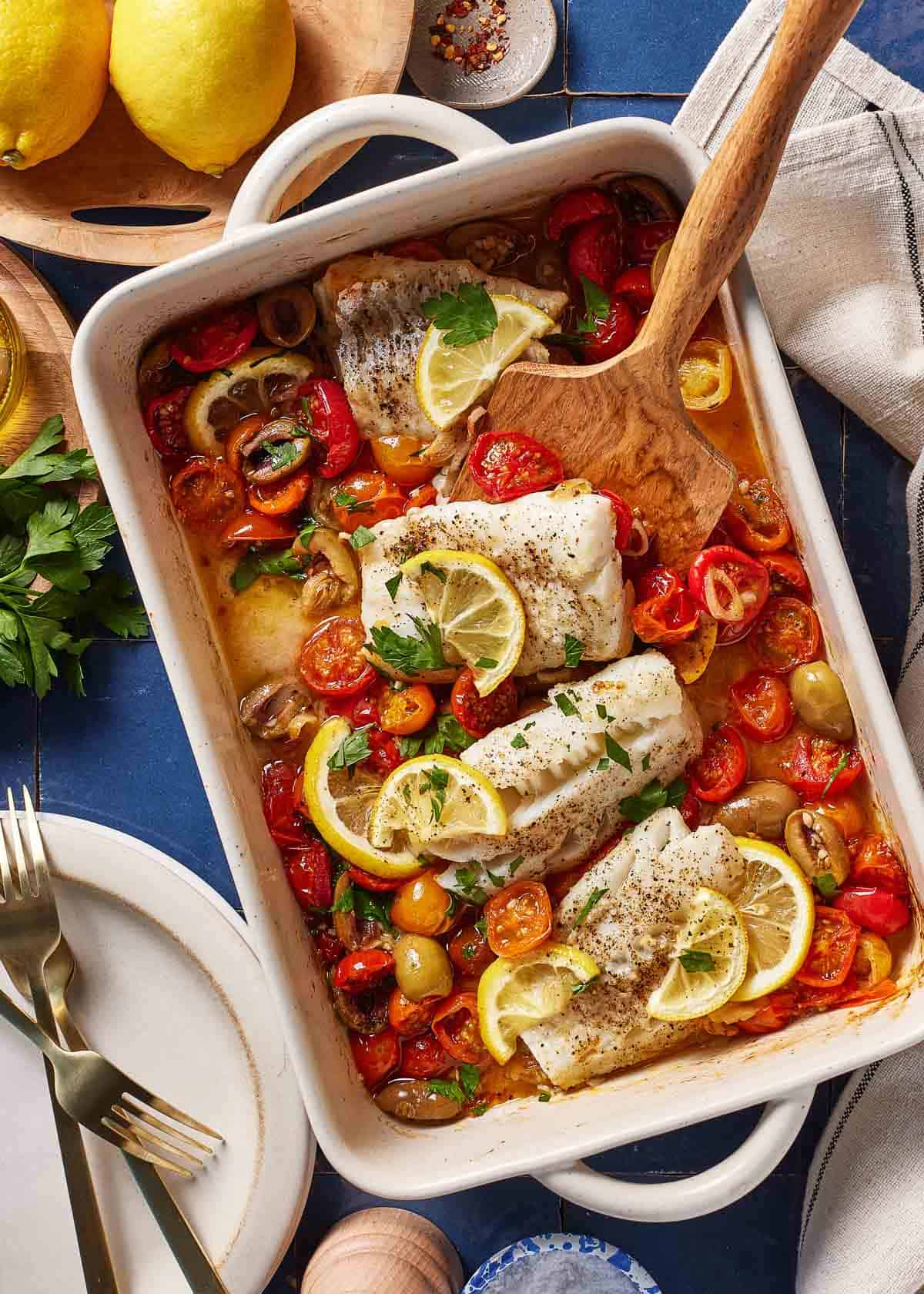 Mediterranean baked cod in a casserole dish from the top.