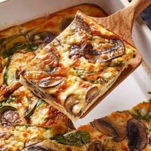 A slice of egg and cottage bake on a spatula.