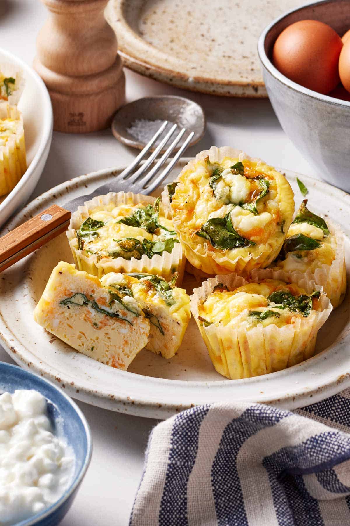 Cottage cheese egg bites on a plate with a fork on the side.