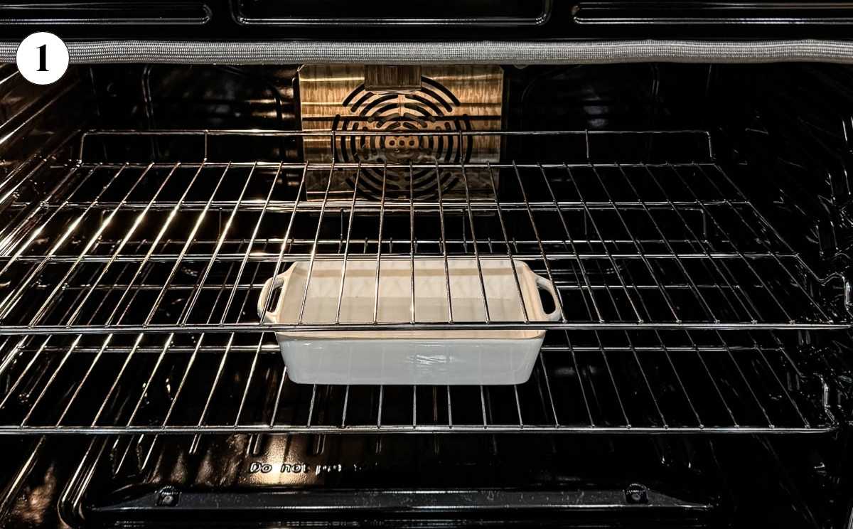 A casserole dish filled with water in an oven.