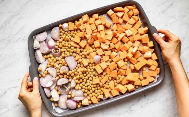 Roasted veggies on a sheet pan from the top view.