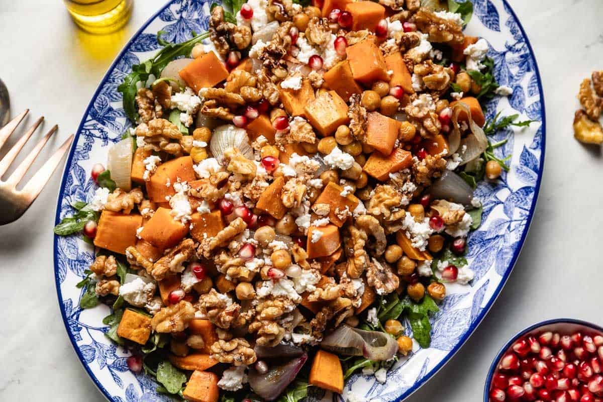 Mediterranean sweet potato salad on a plate from the top view. 