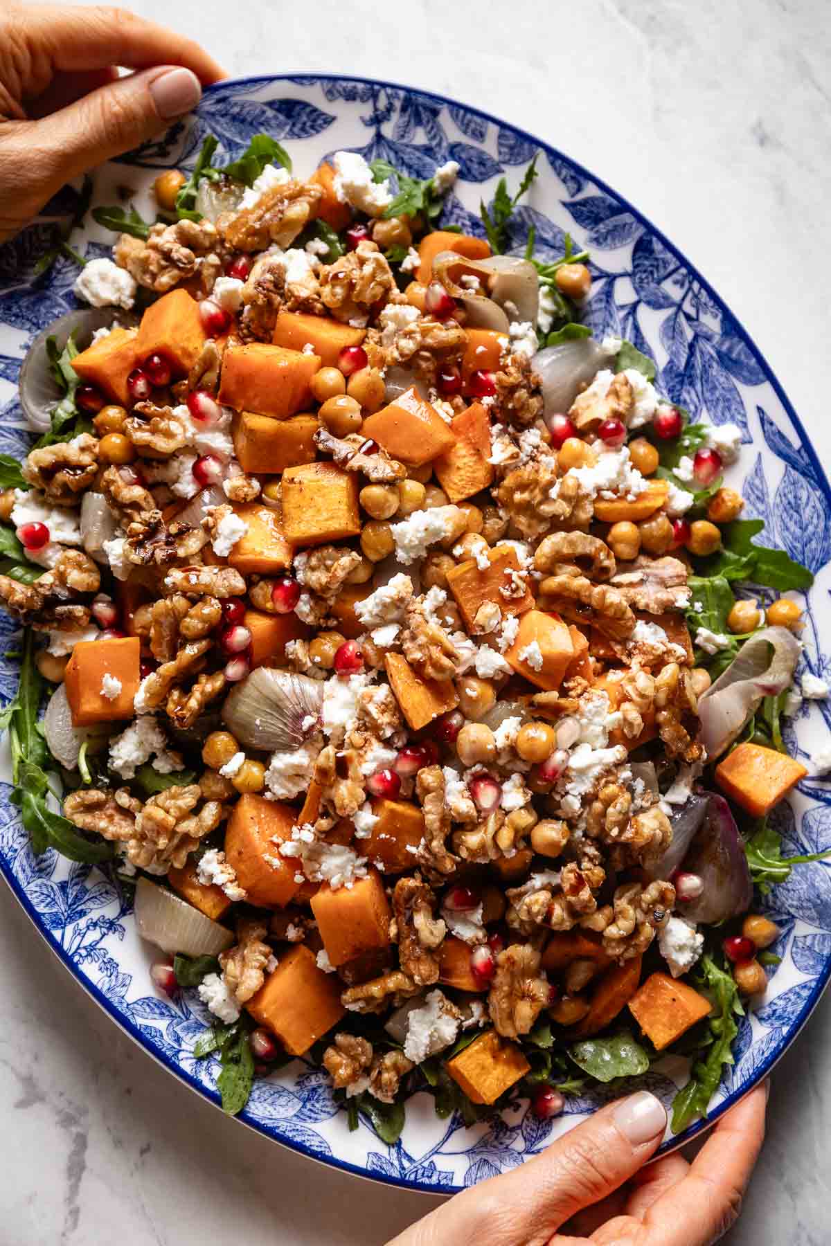 Mediterranean fall sweet potato salad on a plate from the top view.