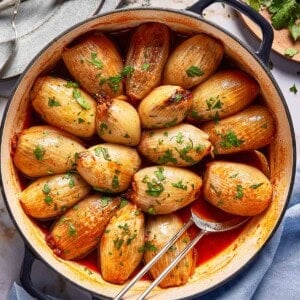 Beef stuffed onions garnished with parsley from the top view.