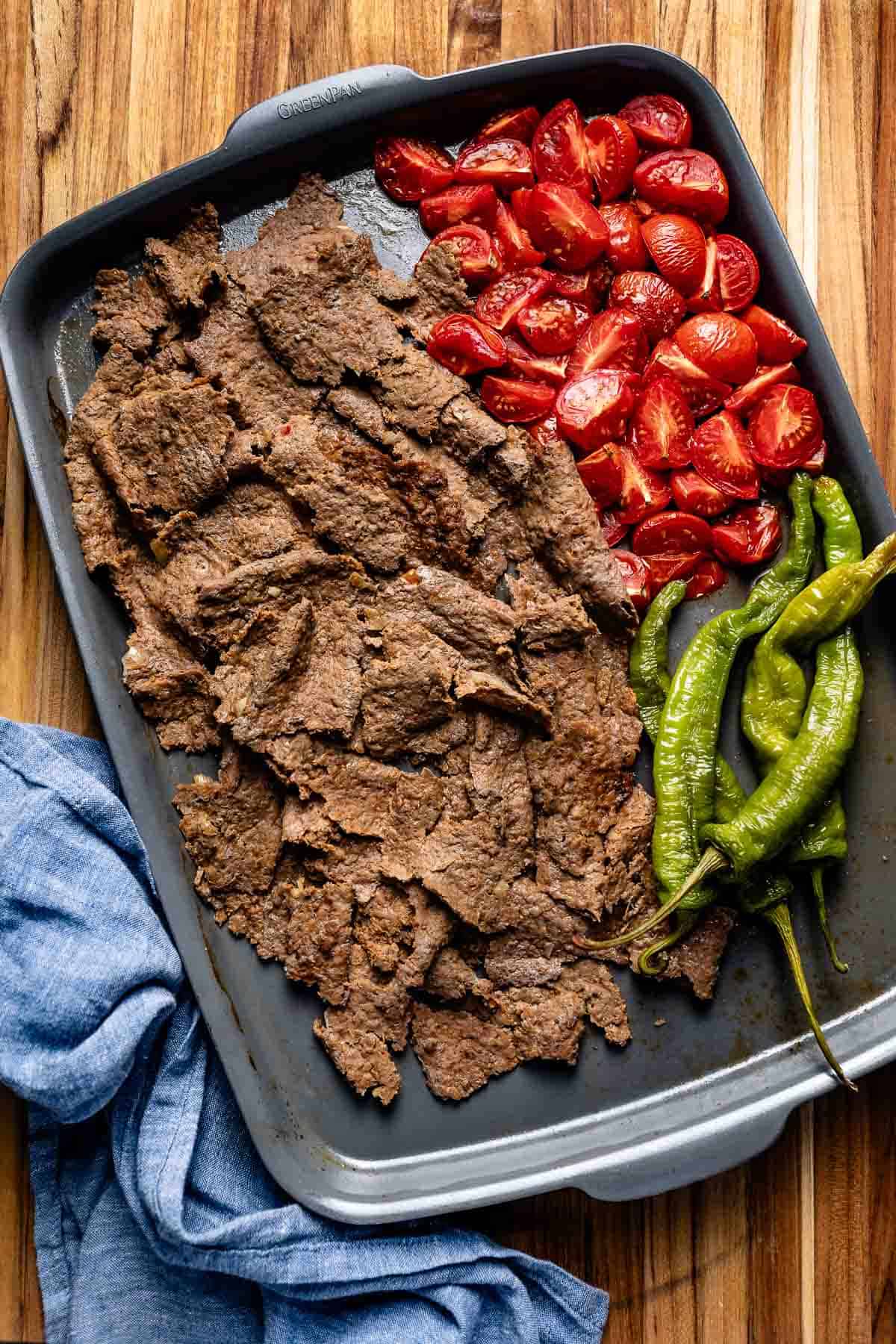 Doner kebab with vegetables on a sheet pan.